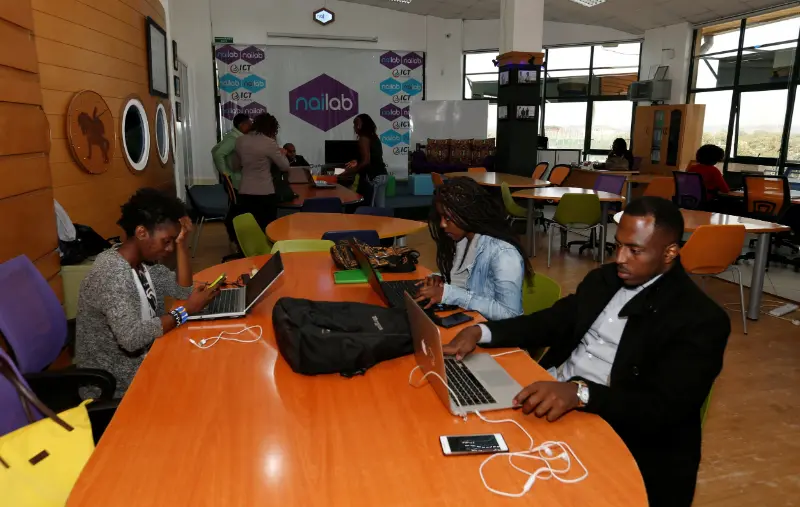 A Kenyan tech office with employees on computers and a visible notice: “Your Data is Safe with Us – PDPA Compliant." Kabugu Advocates LLP – A leading law firm in Kenya providing expert legal services in litigation, real estate, employment law, and more.